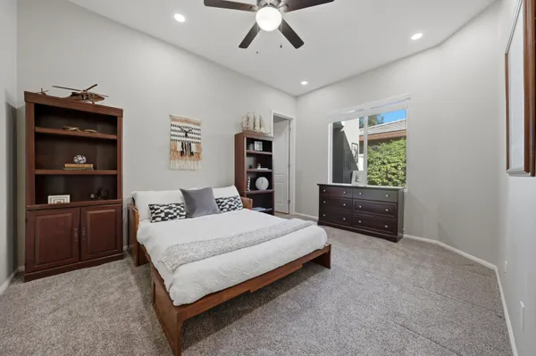 a bathroom with a sink toilet and a mirror