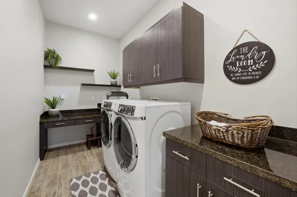 a view of a patio with table and chairs under an umbrella