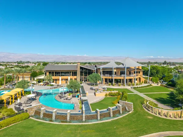 a living room with furniture and a view of kitchen