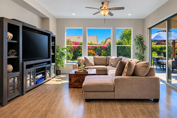 a living room with furniture and a flat screen tv