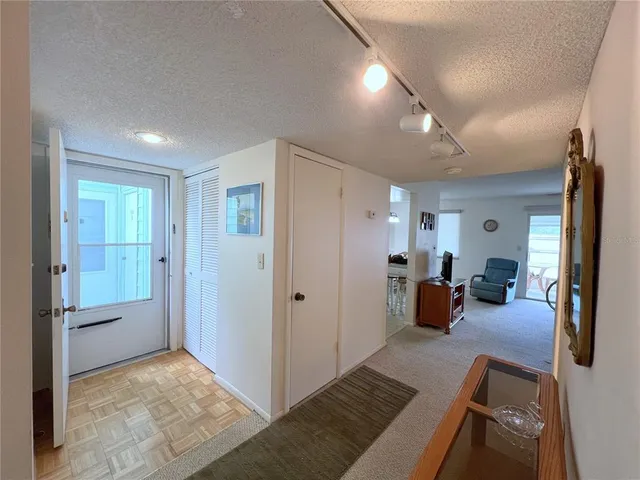 a view of a livingroom with furniture and windows