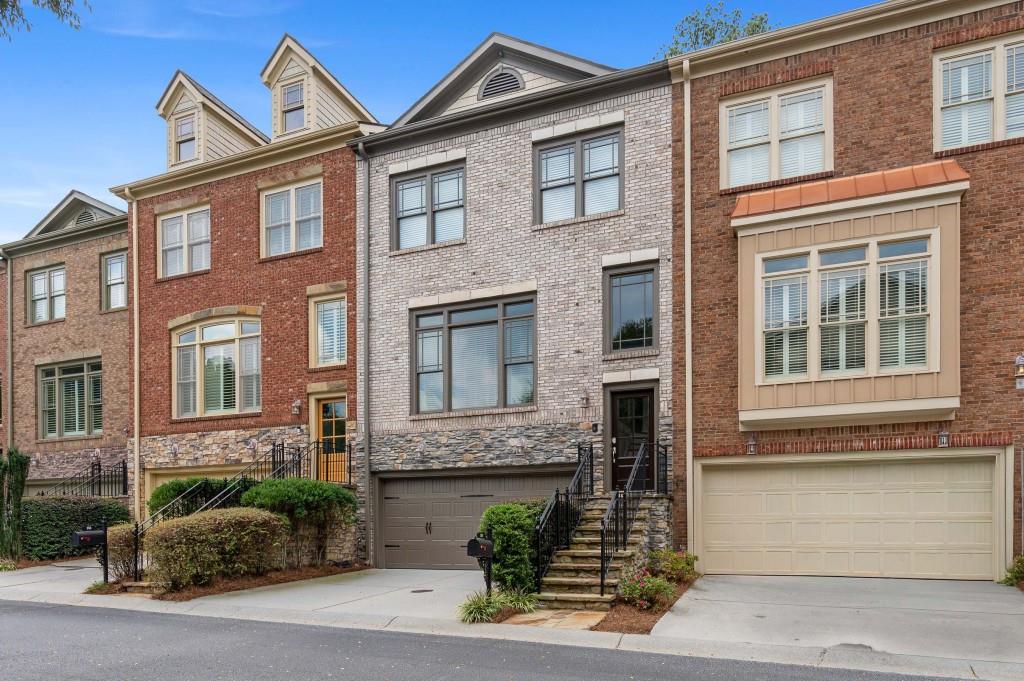 360 Mystic Ridge Lane Sandy Springs, GA 30342 - Photo 1 of 1 a front view of a house with garage