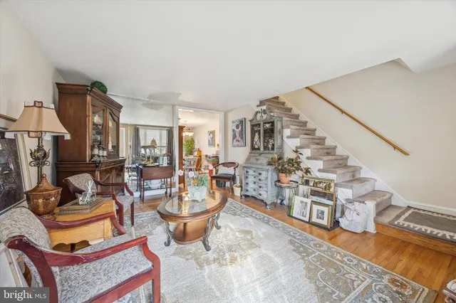 a living room with lots of furniture and a rug