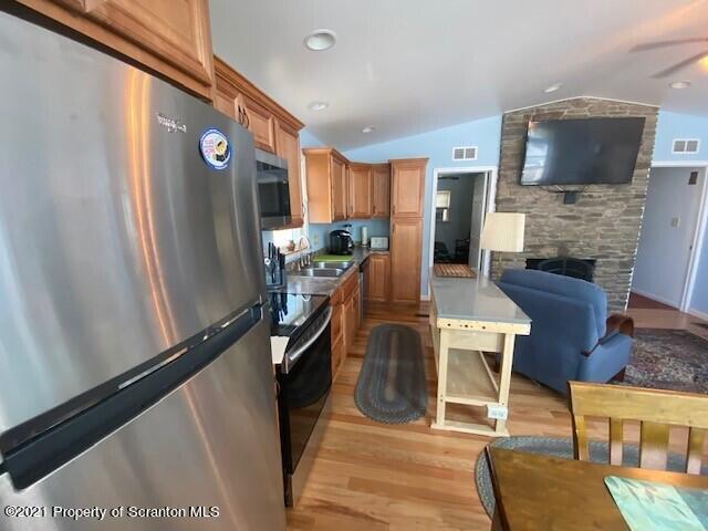 18 Power Line Road Scott Township, PA 18433 - Photo 12 of 34 a living room with furniture and a flat screen tv