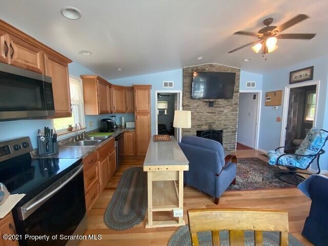 18 Power Line Road Scott Township, PA 18433 - Photo 13 of 34 a large kitchen with cabinets a sink and a stove