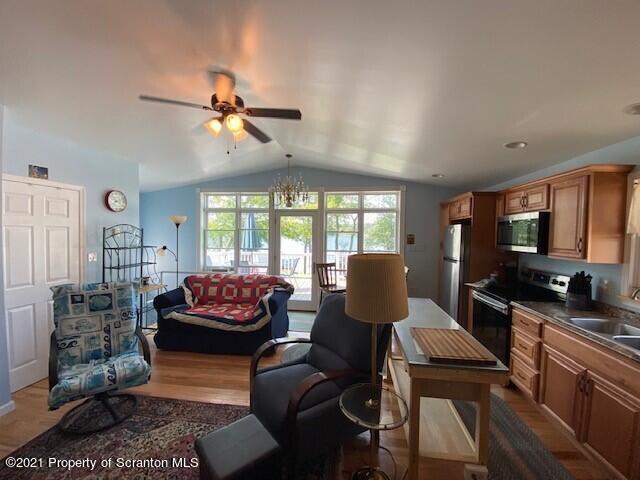 18 Power Line Road Scott Township, PA 18433 - Photo 14 of 34 a living room with furniture a flat screen tv and a large window