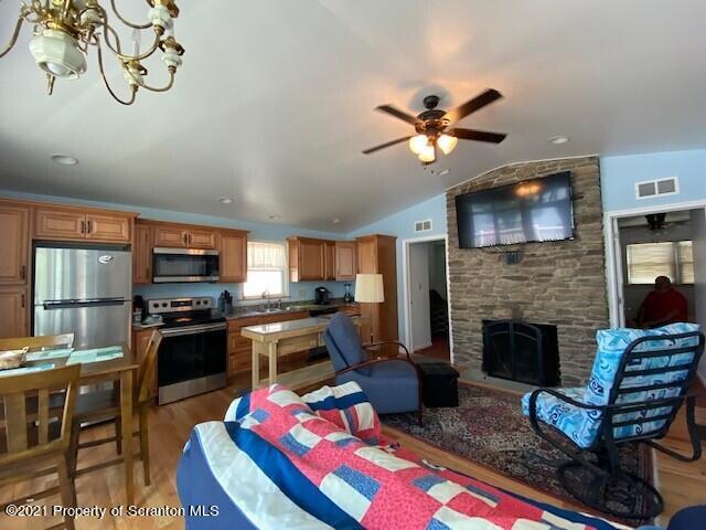 18 Power Line Road Scott Township, PA 18433 - Photo 21 of 34 a living room with furniture fireplace and flat screen tv