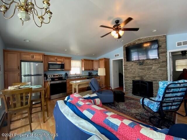 18 Power Line Road Scott Township, PA 18433 - Photo 22 of 34 a living room with furniture fireplace and flat screen tv