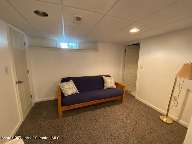 18 Power Line Road Scott Township, PA 18433 - Photo 24 of 34 a living room with a couch and a rug