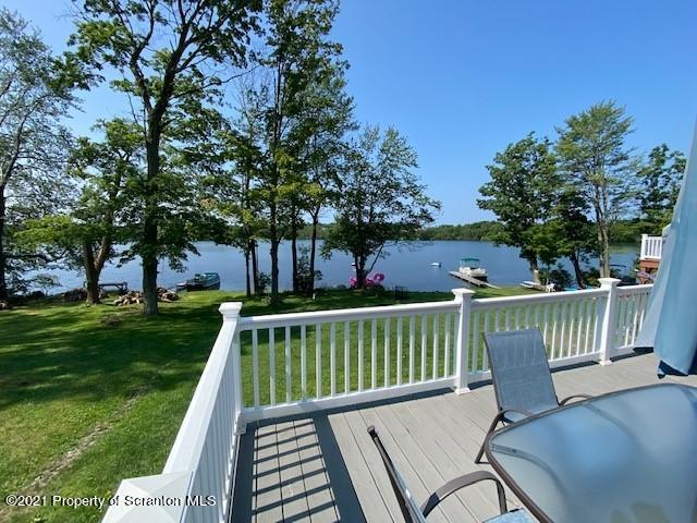 18 Power Line Road Scott Township, PA 18433 - Photo 27 of 34 a view of a roof deck with two chairs and a yard