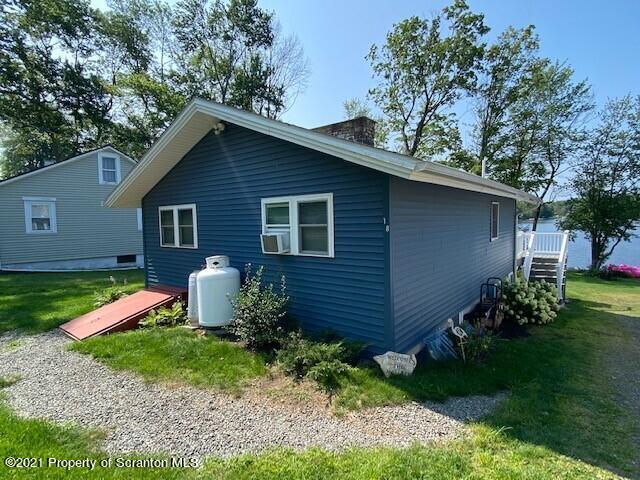 18 Power Line Road Scott Township, PA 18433 - Photo 34 of 34 a view of a backyard with plants and large tree