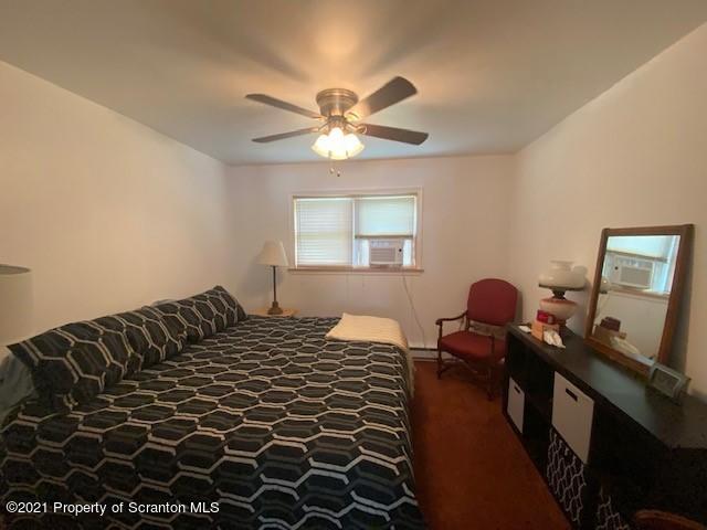 18 Power Line Road Scott Township, PA 18433 - Photo 7 of 34 a bedroom with a bed and wooden floor