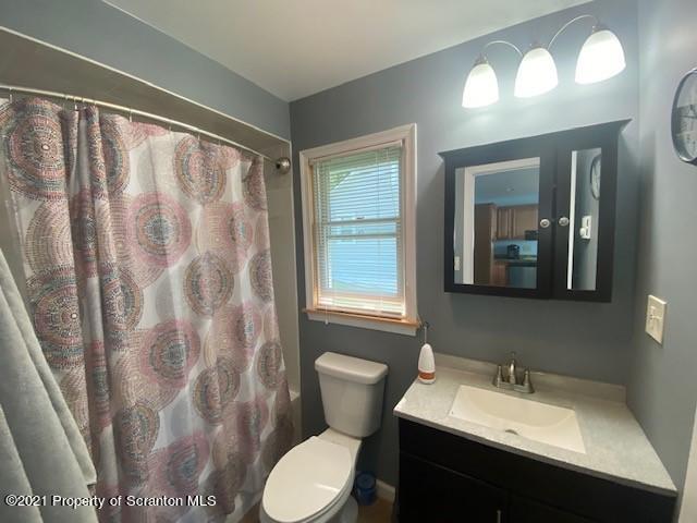 18 Power Line Road Scott Township, PA 18433 - Photo 8 of 34 a bathroom with a sink toilet and a mirror