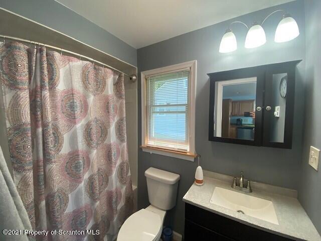 18 Power Line Road Scott Township, PA 18433 - Photo 9 of 34 a bathroom with a sink toilet and a mirror