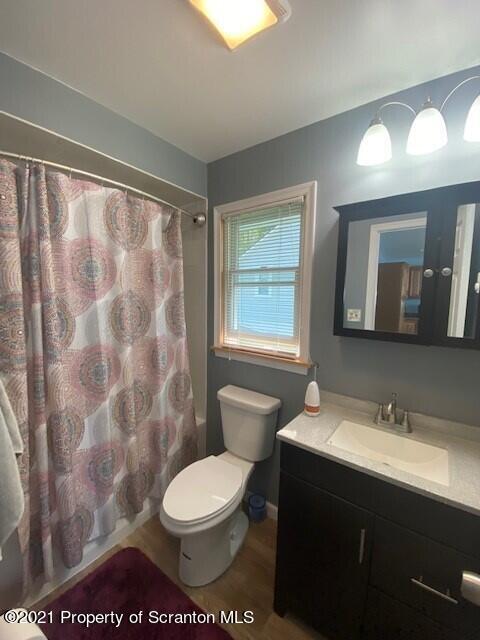 18 Power Line Road Scott Township, PA 18433 - Photo 10 of 34 a bathroom with a toilet a sink and a large mirror