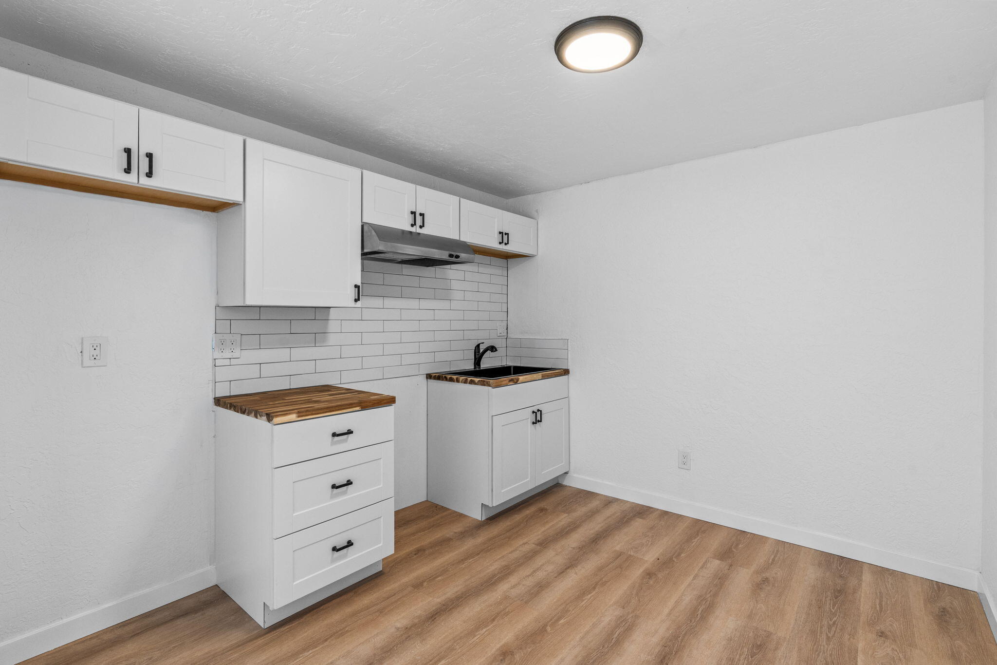 1700 Northeast Wells Acres Road, Unit 25 Bend, OR 97701 - Photo 12 of 25 a kitchen with granite countertop a sink cabinets and stainless steel appliances