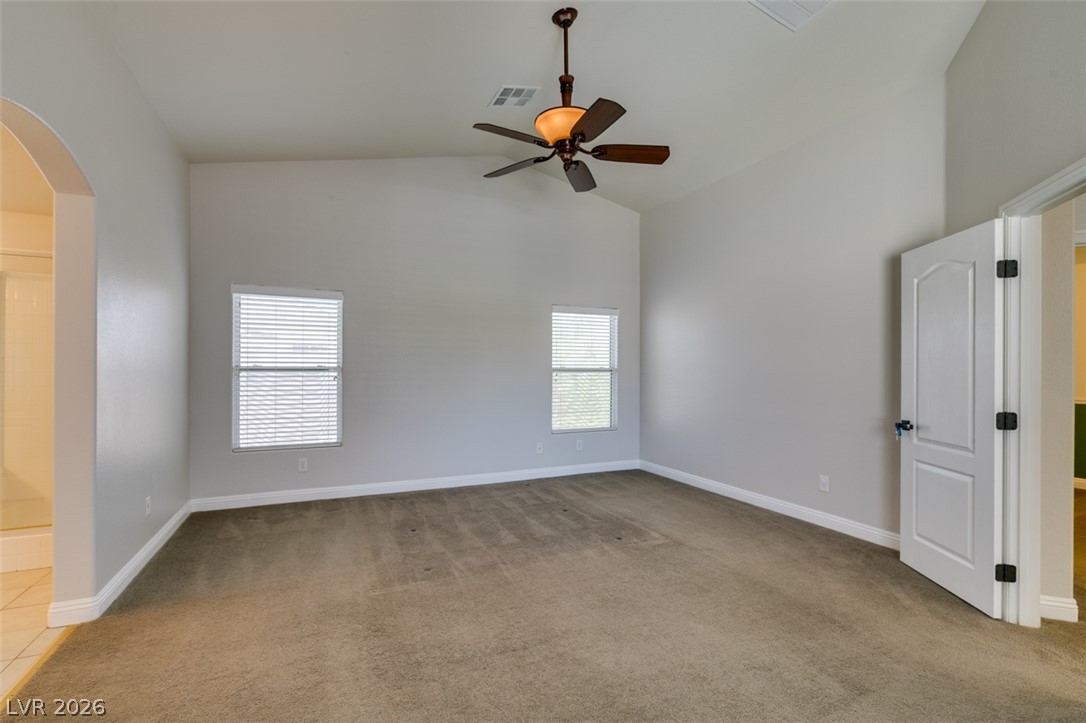 8909 Houston Ridge Avenue Las Vegas, NV 89178 - Photo 34 of 45 A quiet retreat, this bedroom offers vaulted ceilings and a cooling ceiling fan.