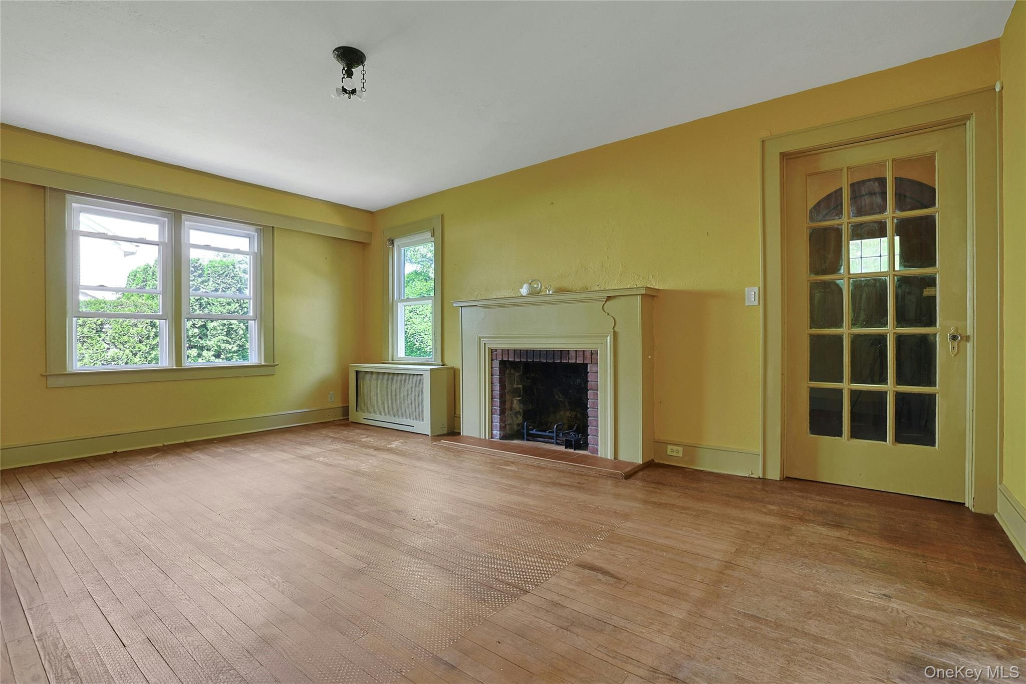 333 South Middletown Road Nanuet, NY 10954 - Photo 9 of 22 a view of an empty room with a window and fireplace