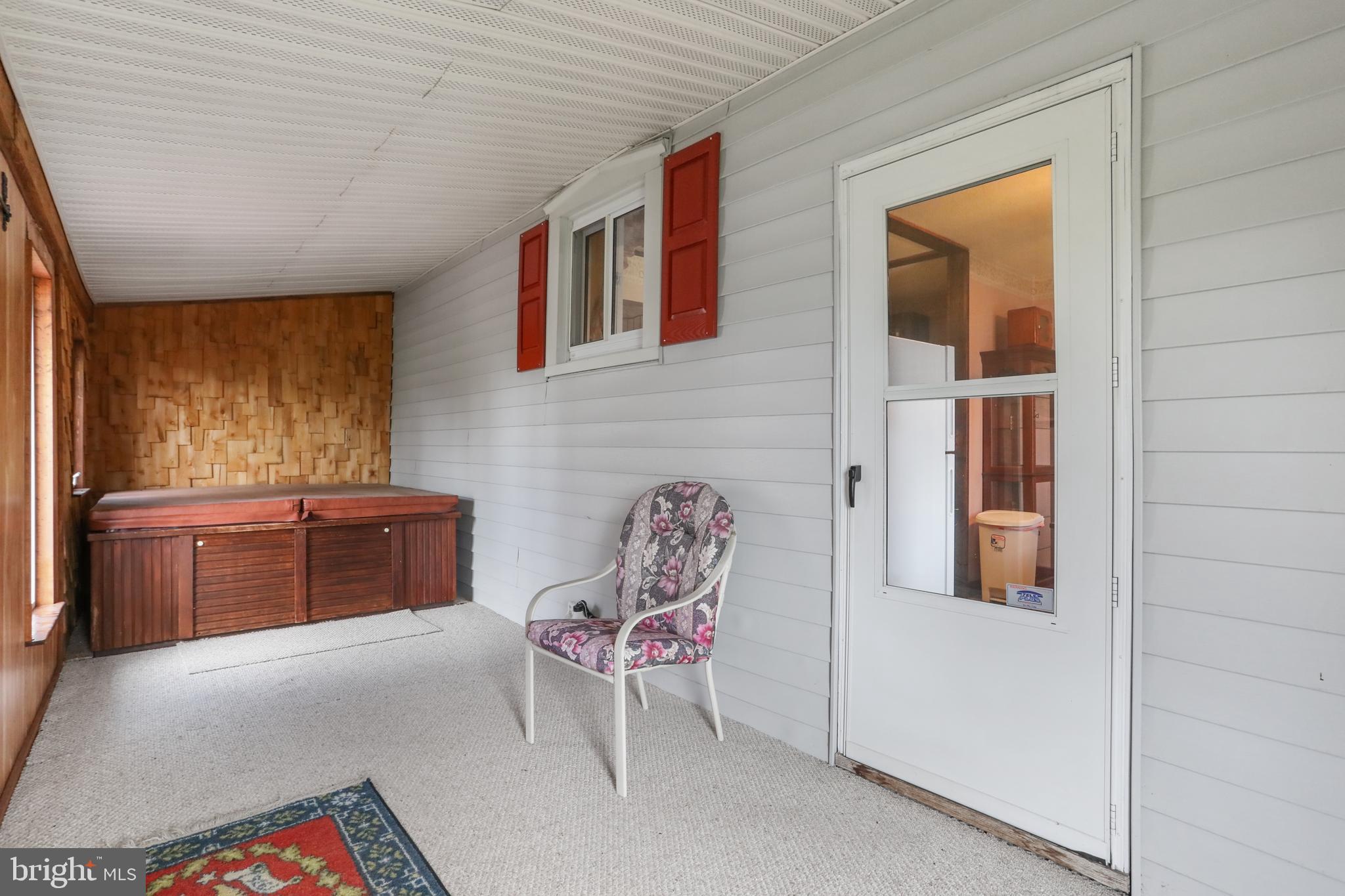 14306 Barkdoll Road Smithsburg, MD 21783 - Photo 28 of 55 Enclosed back porch included hot tub.