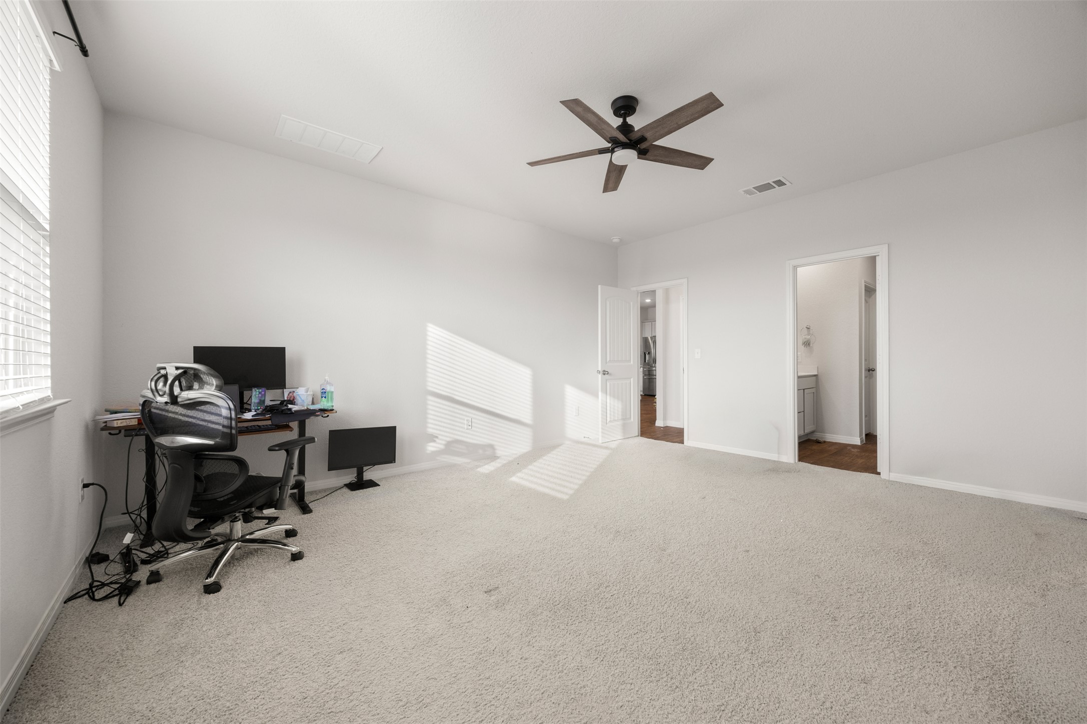 413 Emerald Cove Georgetown, TX 78626 - Photo 12 of 15 Carpeted office with ceiling fan and baseboards