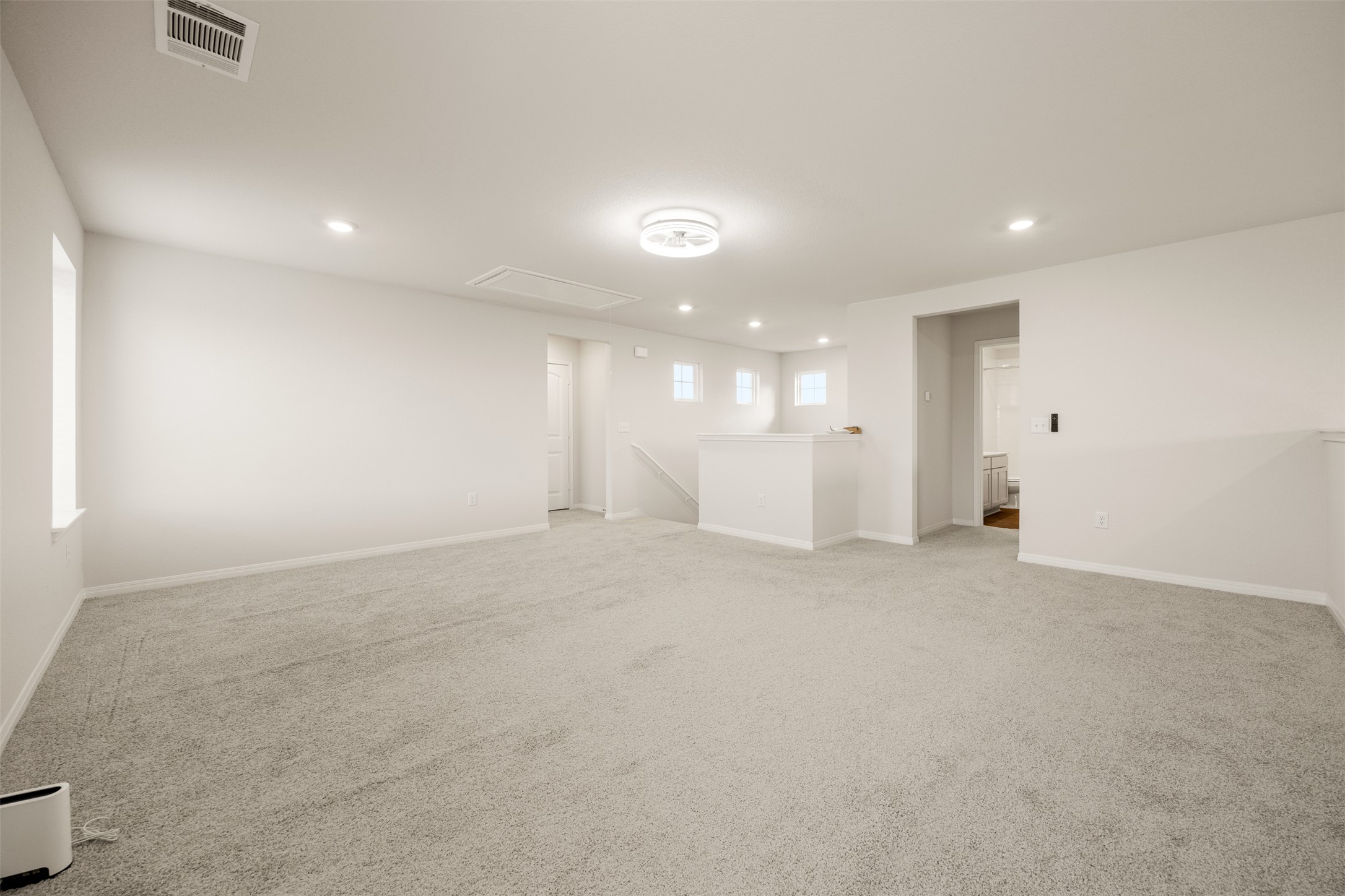 413 Emerald Cove Georgetown, TX 78626 - Photo 2 of 15 Carpeted empty room featuring recessed lighting and attic access