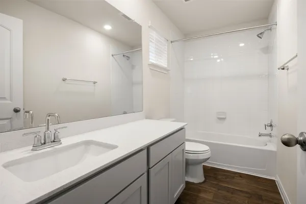 an empty room with closet and fan