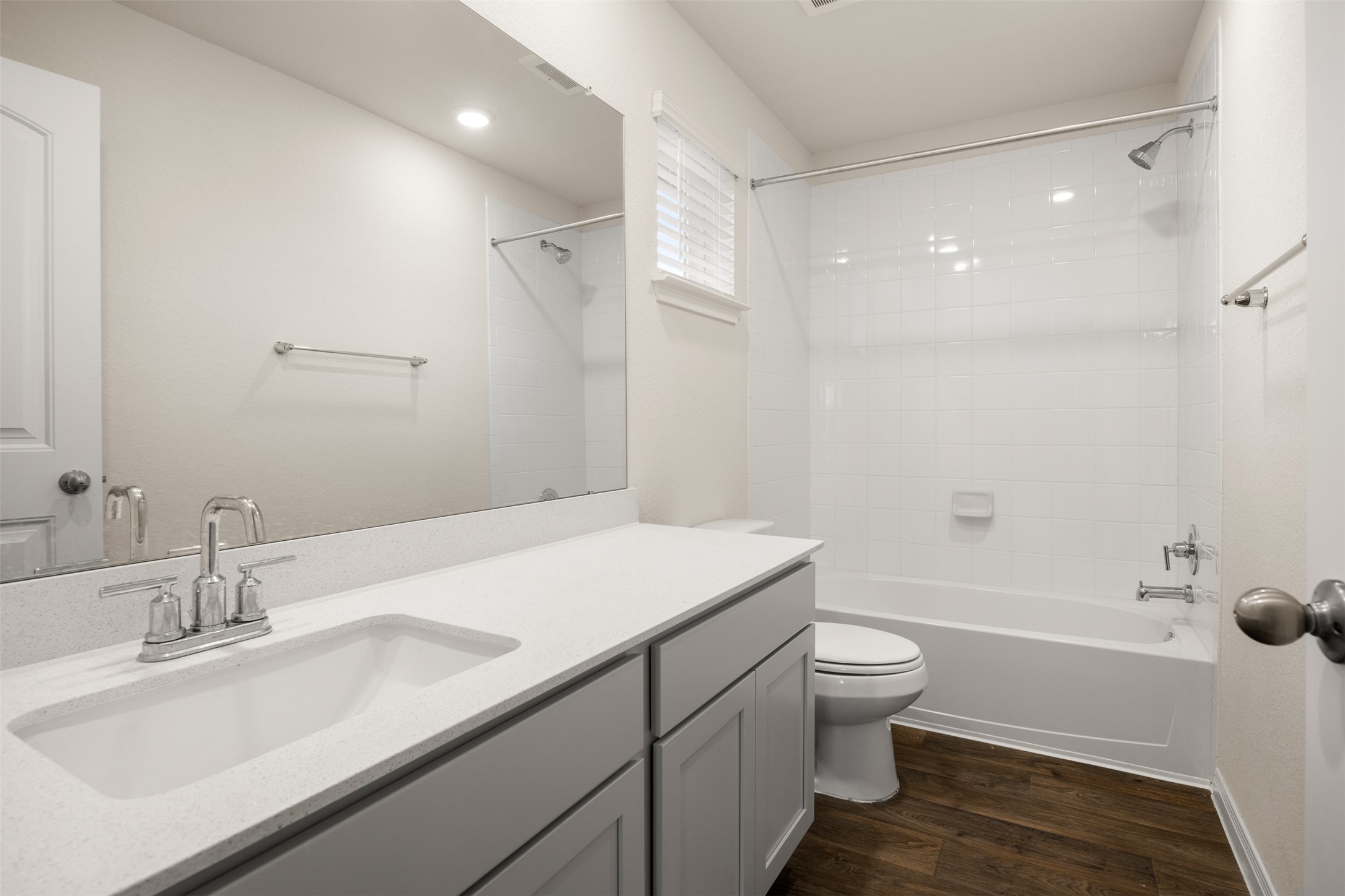413 Emerald Cove Georgetown, TX 78626 - Photo 3 of 15 Full bathroom with vanity, bathing tub / shower combination, and dark wood-style flooring
