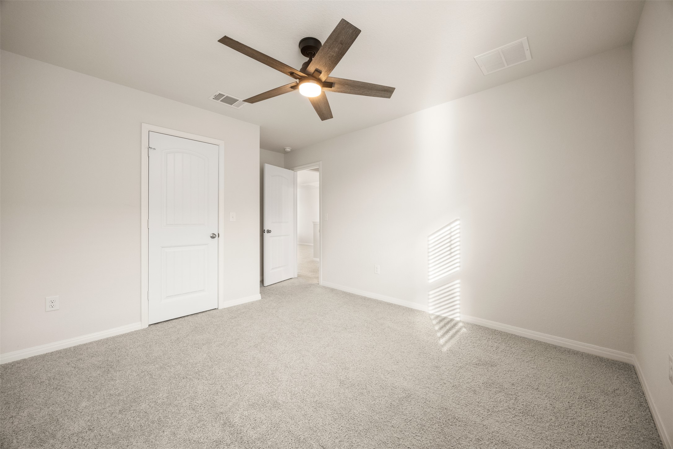 413 Emerald Cove Georgetown, TX 78626 - Photo 4 of 15 Unfurnished bedroom with carpet and ceiling fan