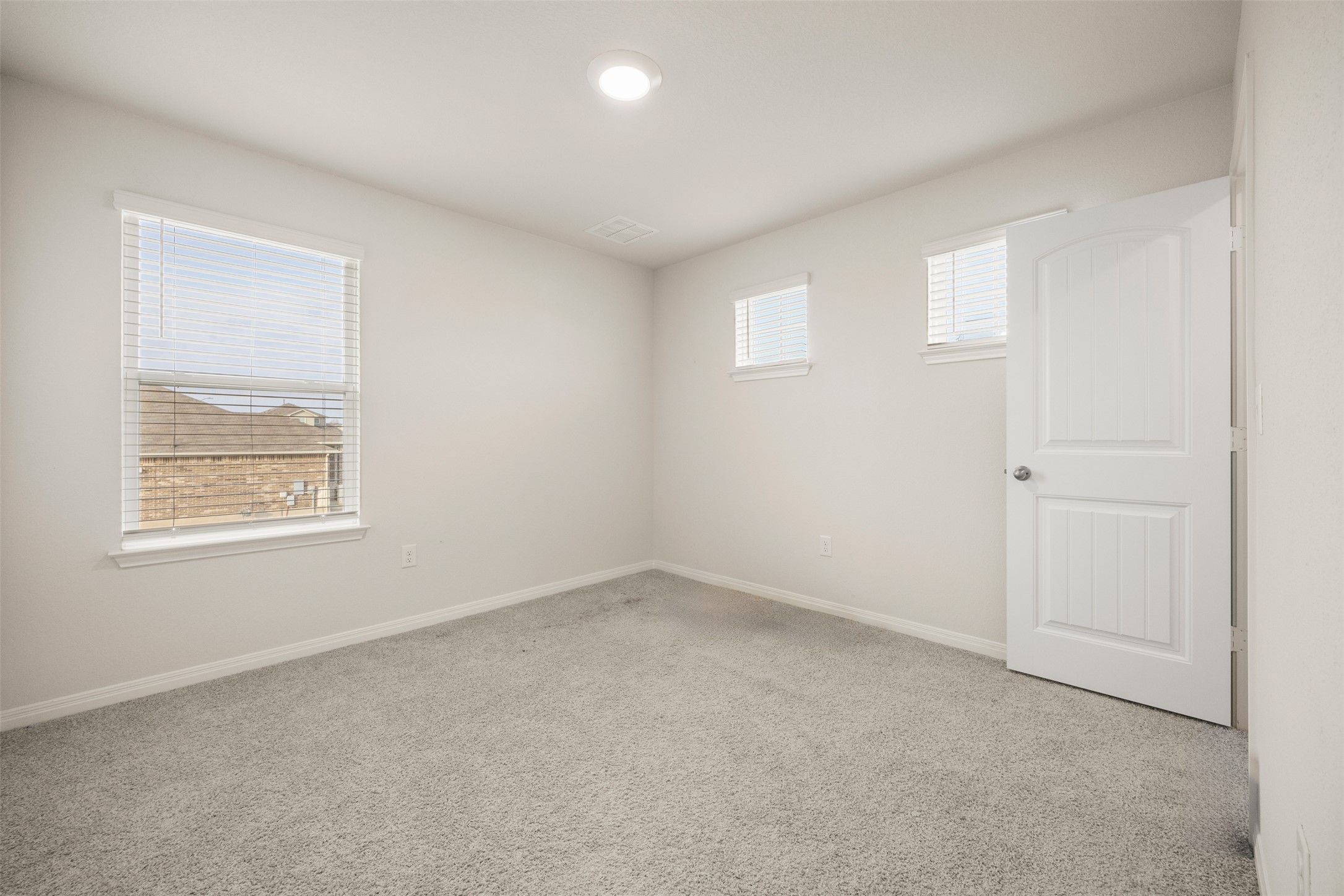 413 Emerald Cove Georgetown, TX 78626 - Photo 5 of 15 Spare room featuring light carpet and baseboards