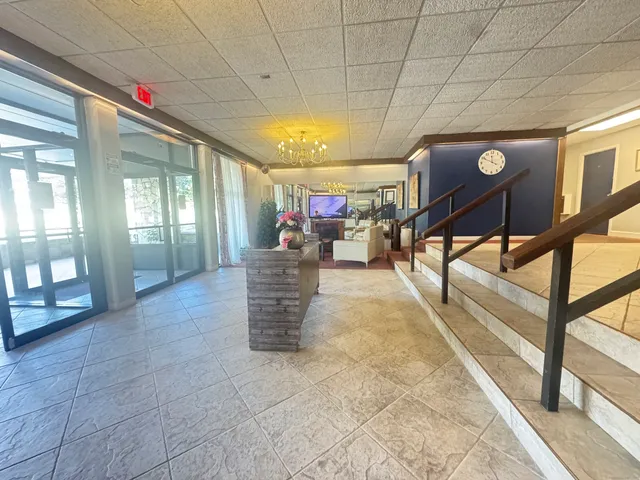 a view of a swimming pool with a yard