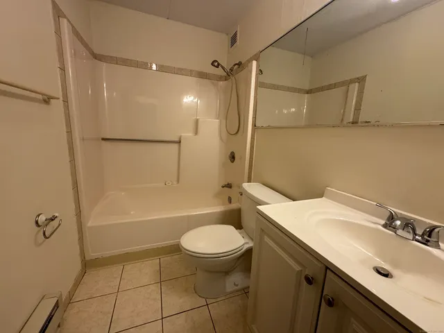 a view of a hallway with seating space