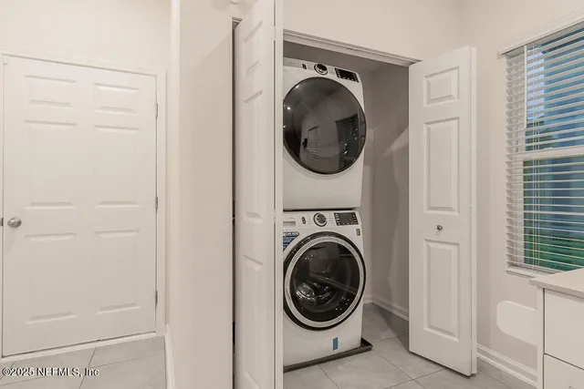 a view of a hallway with washer and dryer