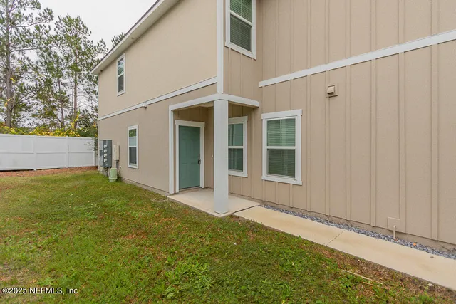 a view of a backyard of the house