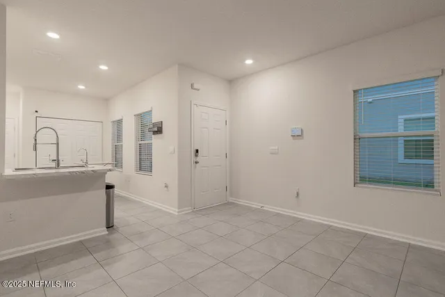 a view of a kitchen with a sink and a window