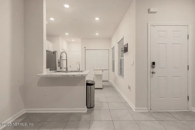 a bathroom with a sink a mirror and a shower