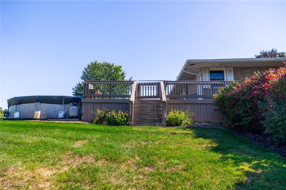 1791 Beal Road Mansfield, OH 44903 - Photo 4 of 50 View of grassy yard featuring a wooden deck and stairs