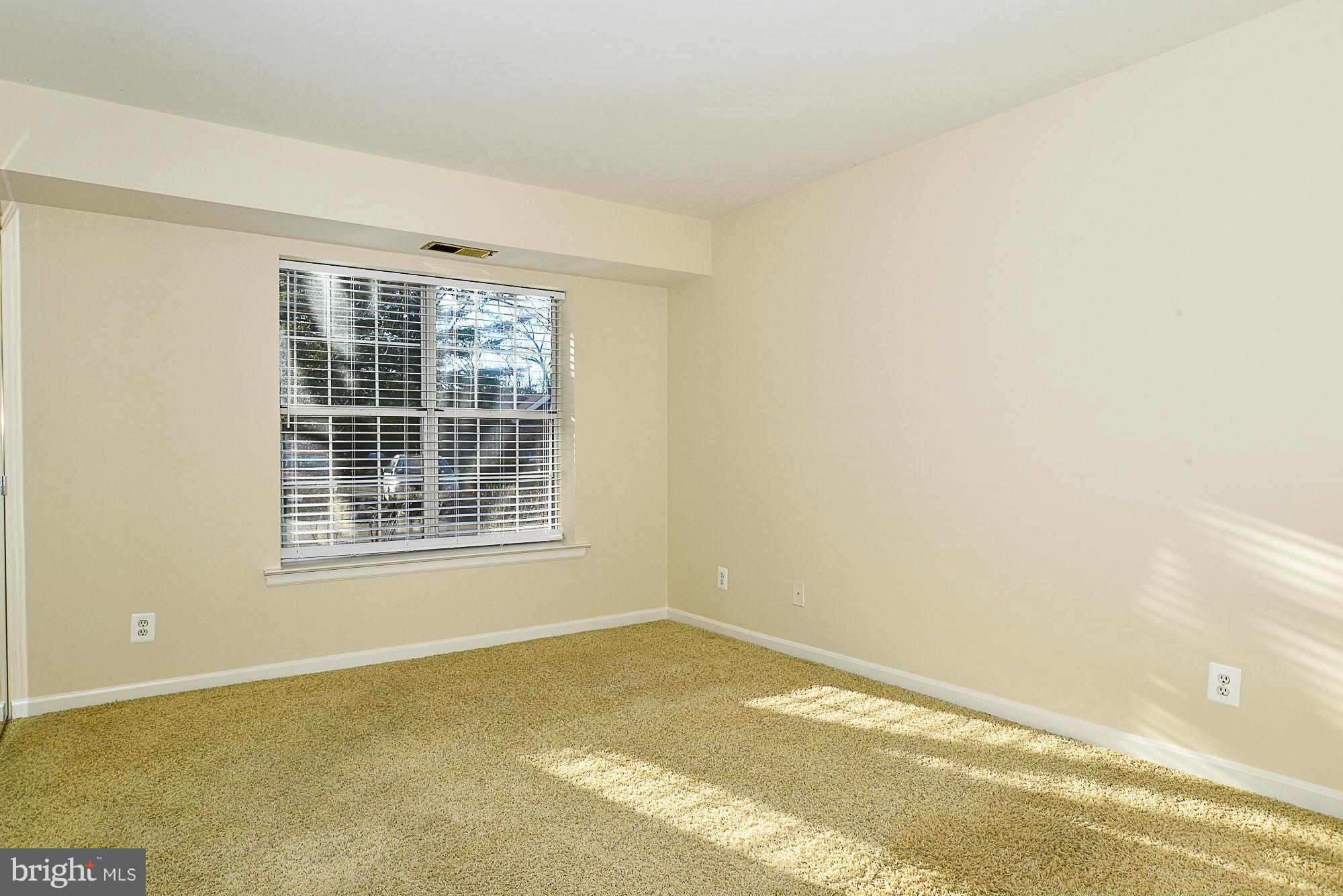5932 Cove Landing Road, Unit 201D Burke, VA 22015 - Photo 11 of 24 a view of an empty room with a window
