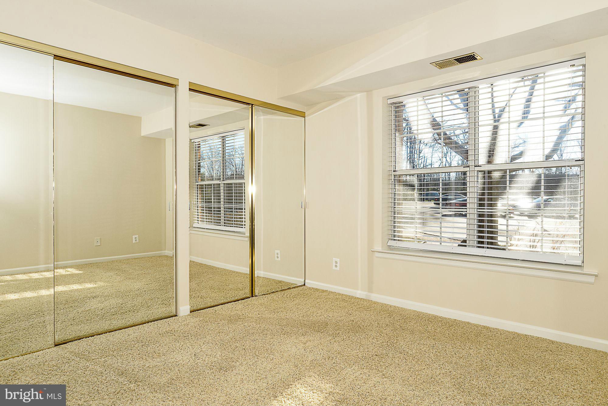 5932 Cove Landing Road, Unit 201D Burke, VA 22015 - Photo 12 of 24 a view of an empty room with a window