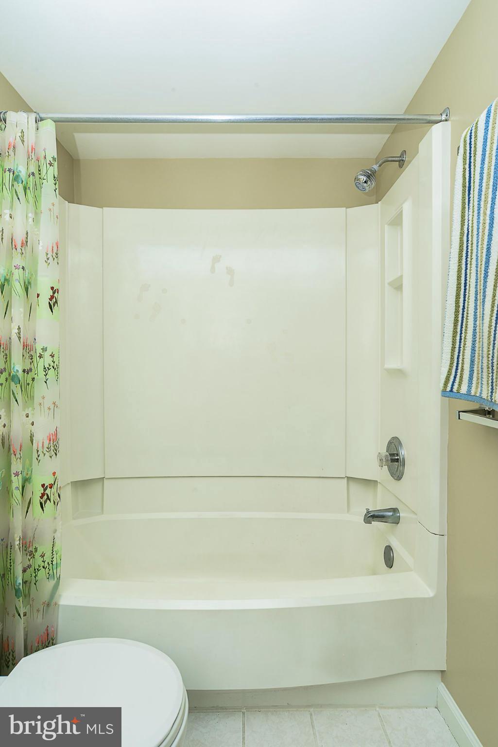 5932 Cove Landing Road, Unit 201D Burke, VA 22015 - Photo 16 of 24 a bathroom with a bathtub and shower