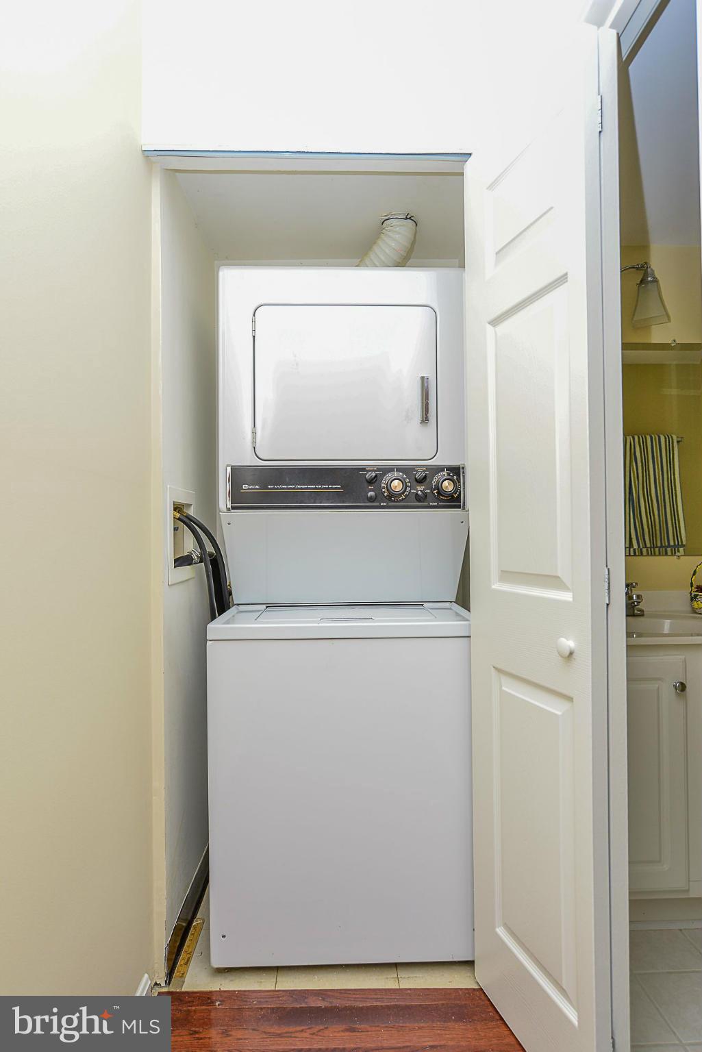 5932 Cove Landing Road, Unit 201D Burke, VA 22015 - Photo 17 of 24 a utility room with dryer and washer