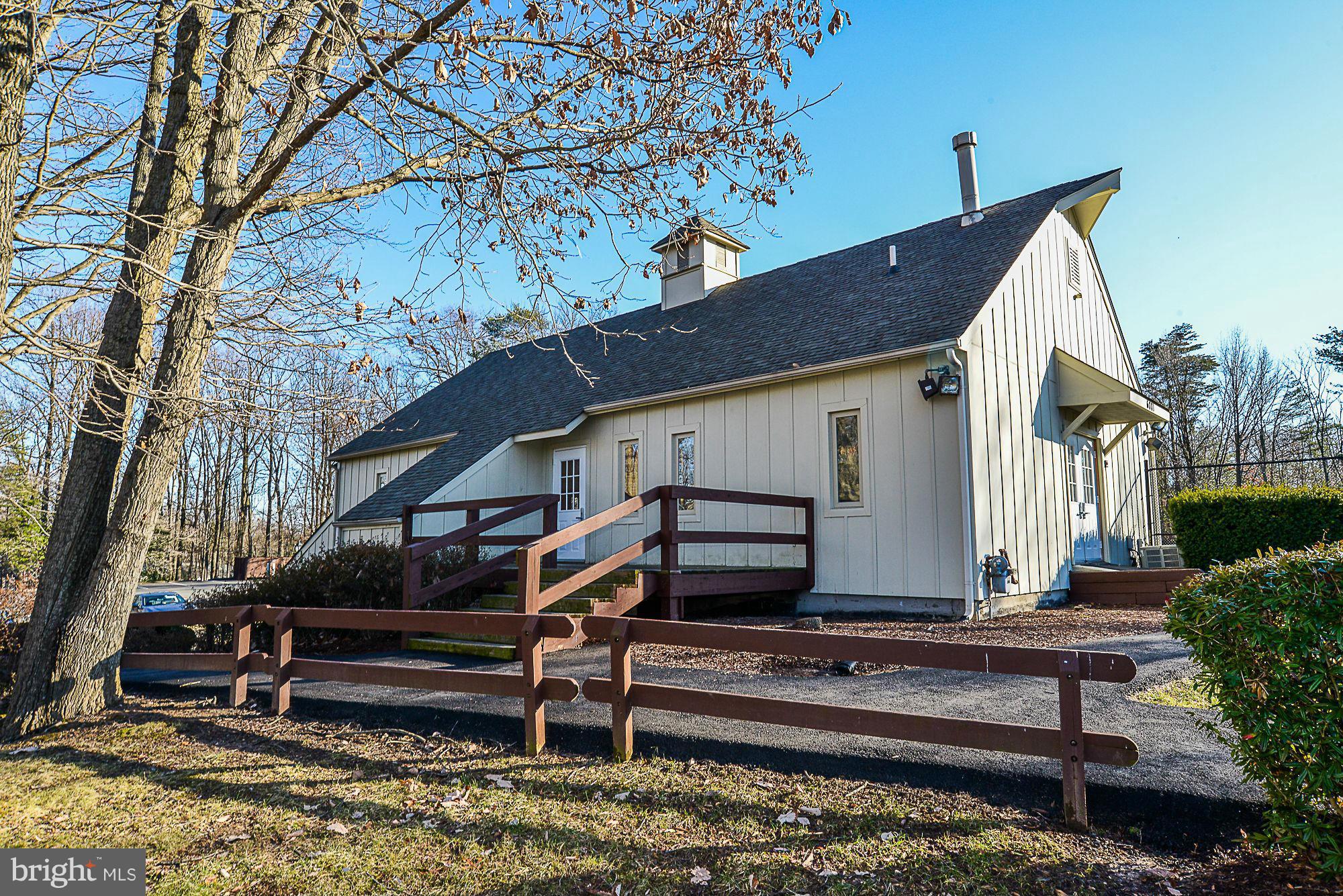 5932 Cove Landing Road, Unit 201D Burke, VA 22015 - Photo 23 of 24 a front view of a house with a yard