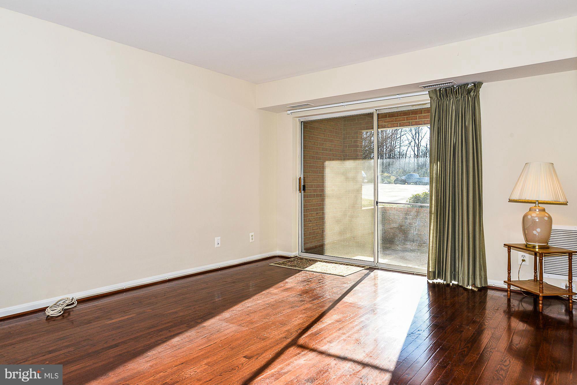 5932 Cove Landing Road, Unit 201D Burke, VA 22015 - Photo 4 of 24 a view of an empty room and window