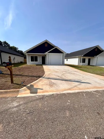 a big house with a big yard and large trees