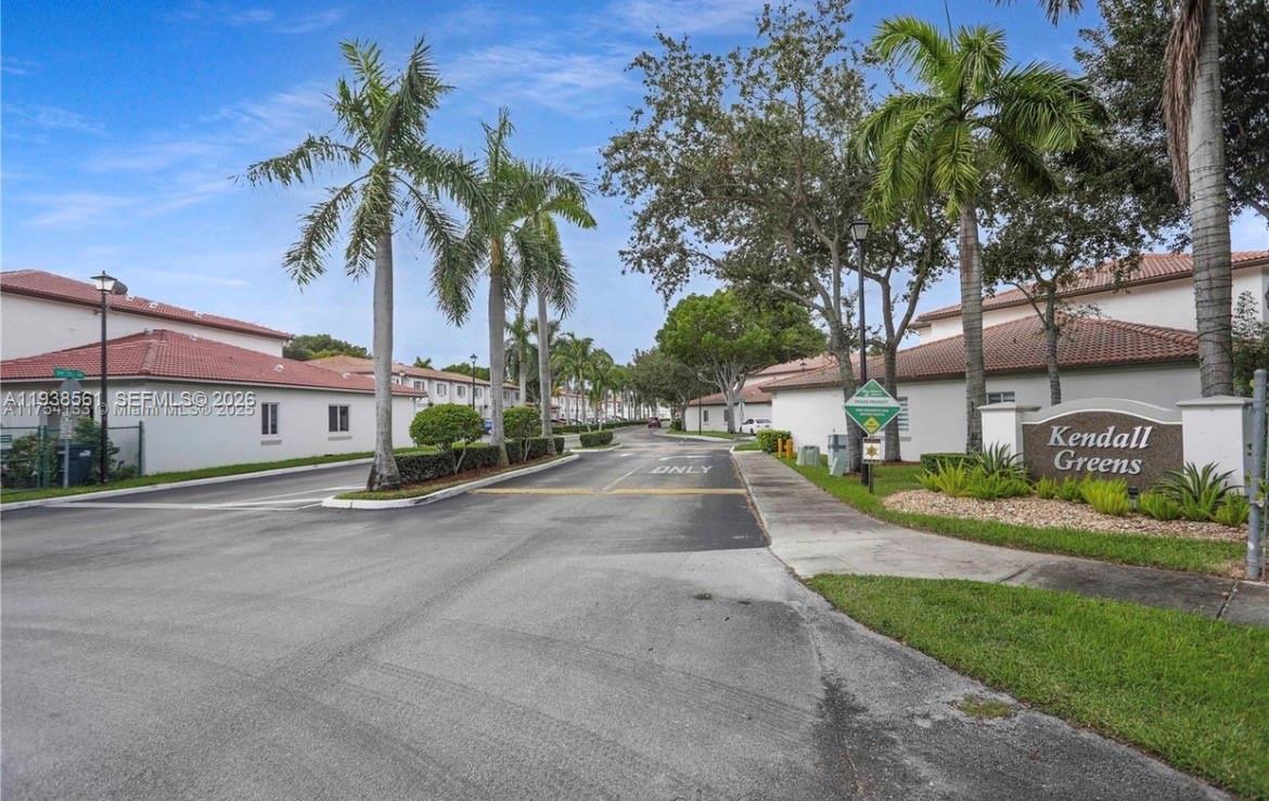 8520 Southwest 150th Avenue, Unit 9 Miami, FL 33193 - Photo 2 of 3 a view of a street with a building in front of it