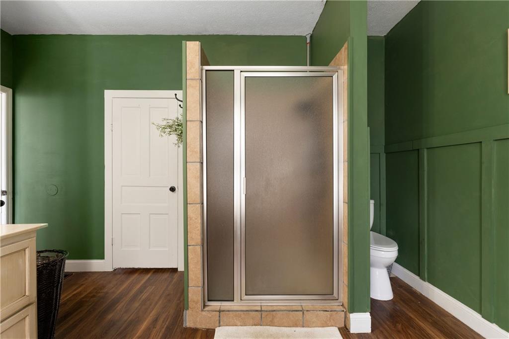 712 College Street Calhoun, GA 30701 - Photo 18 of 31 a bathroom with a shower and a toilet