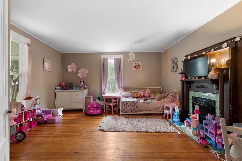 712 College Street Calhoun, GA 30701 - Photo 19 of 31 a bedroom with furniture and a flat screen tv