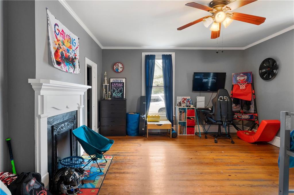 712 College Street Calhoun, GA 30701 - Photo 21 of 31 a view of a livingroom with furniture and a ceiling fan