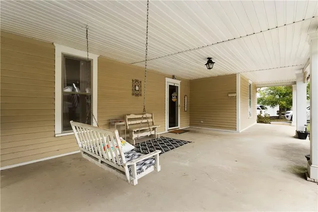 a view of backyard with a chair and table
