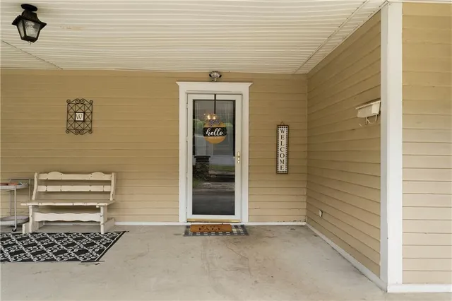 a front view of a house with a empty space