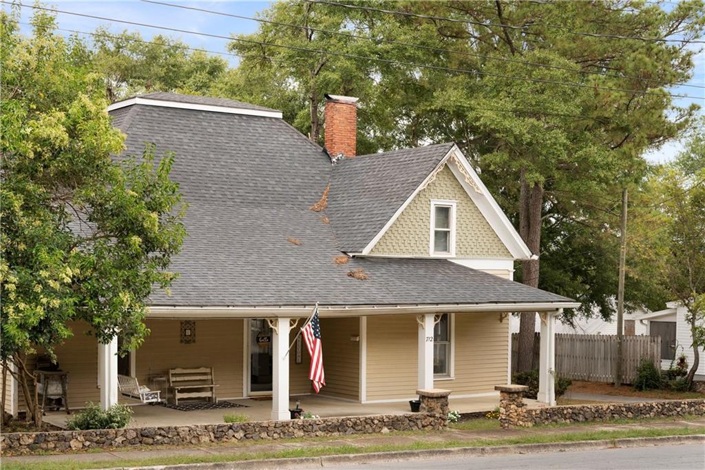 712 College Street Calhoun, GA 30701 - Photo 3 of 31 a front view of a house with garden